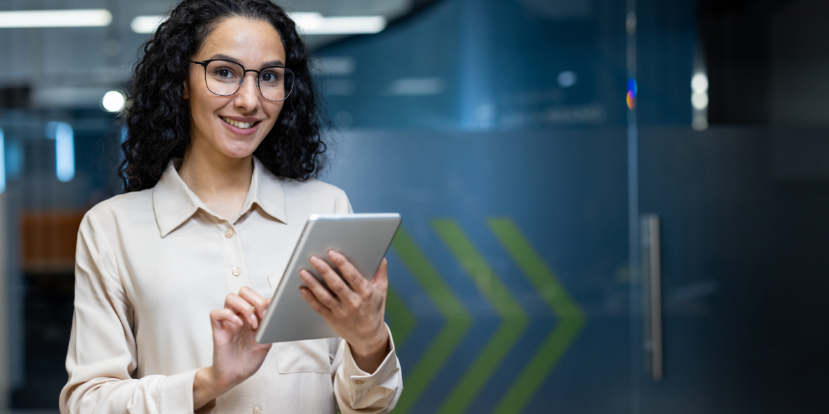 A professional woman holding a tablet